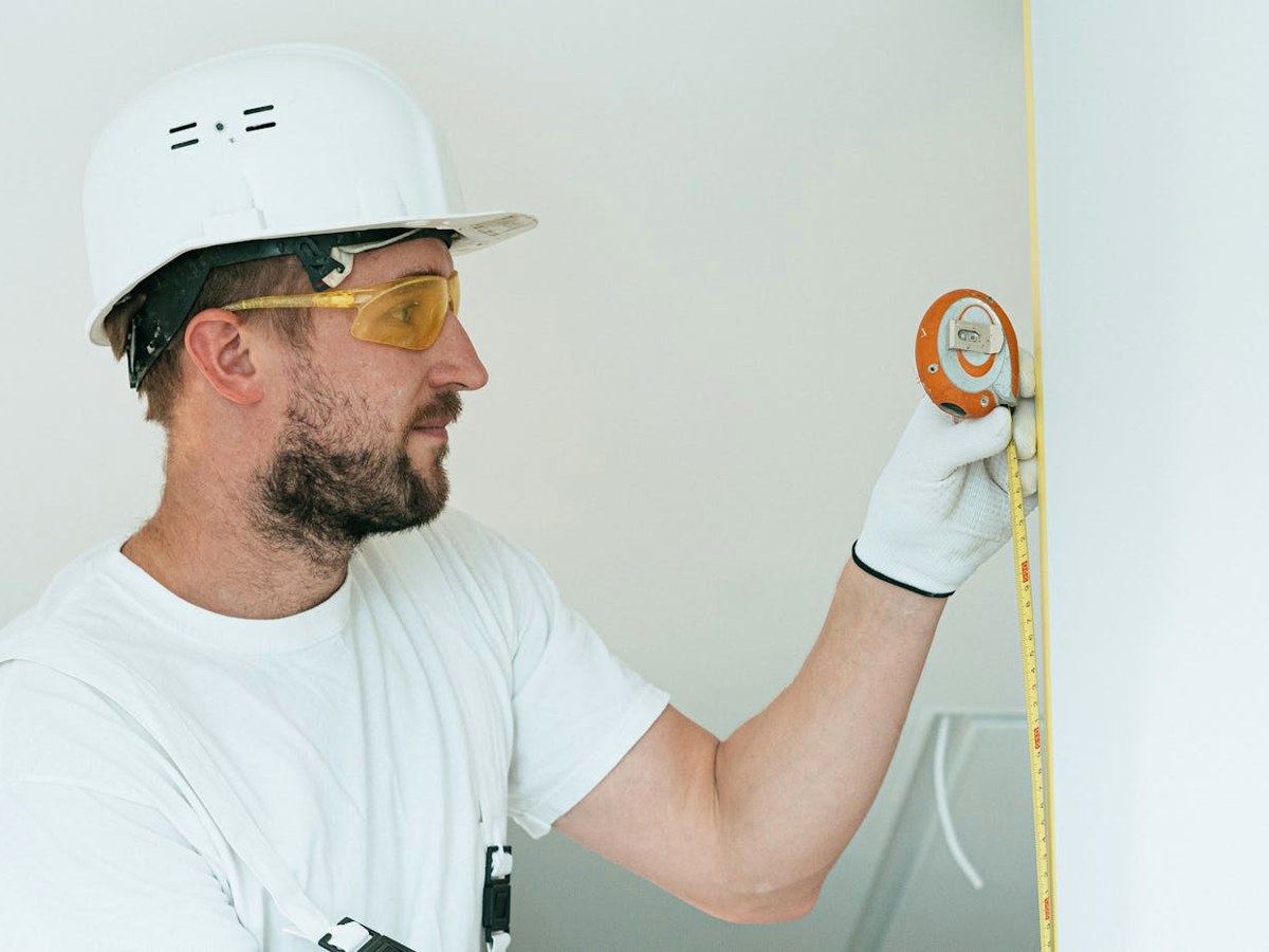 Contractor reviewing plans on a job site